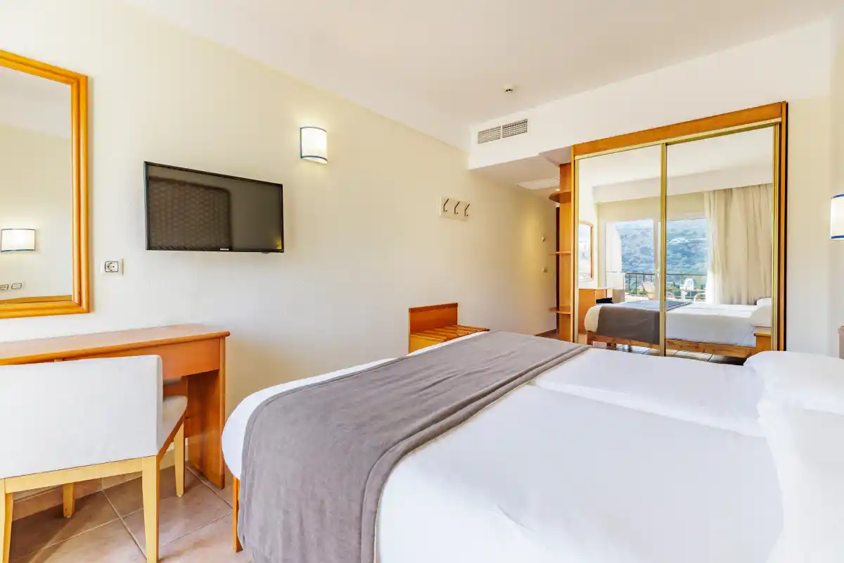 Bed in the room at Hotel Eden Nord Sóller