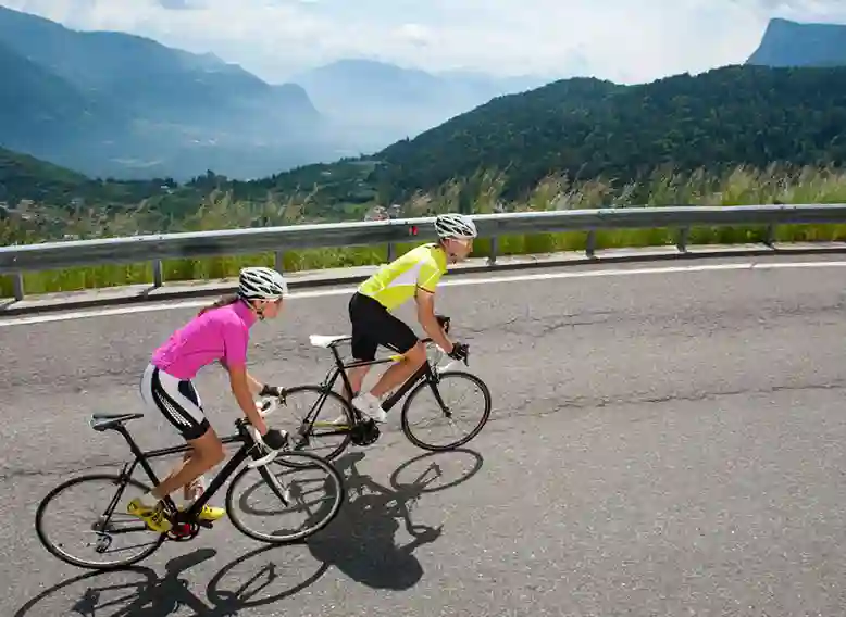 cyclists riding along a steep road