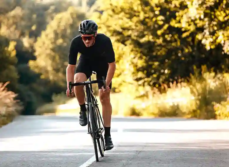 cyclist riding along the road